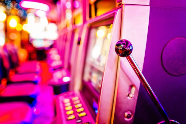 Live casino dealer at blackjack table streaming to mobile players